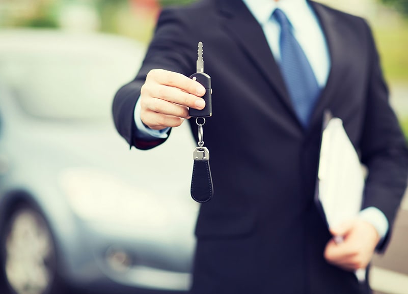 Man Holding Car Keys